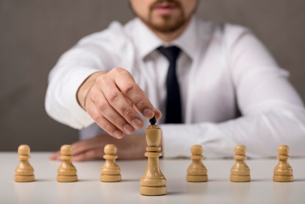 front-view-businessman-holding-king_23-2148569086.jpg Complete Strategic Mastery