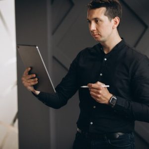 handsome-business-man-working-with-tablet-office_1303-22738.jpg Consulting Essentials