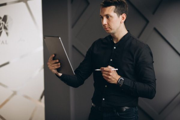 handsome-business-man-working-with-tablet-office_1303-22738.jpg Consulting Essentials